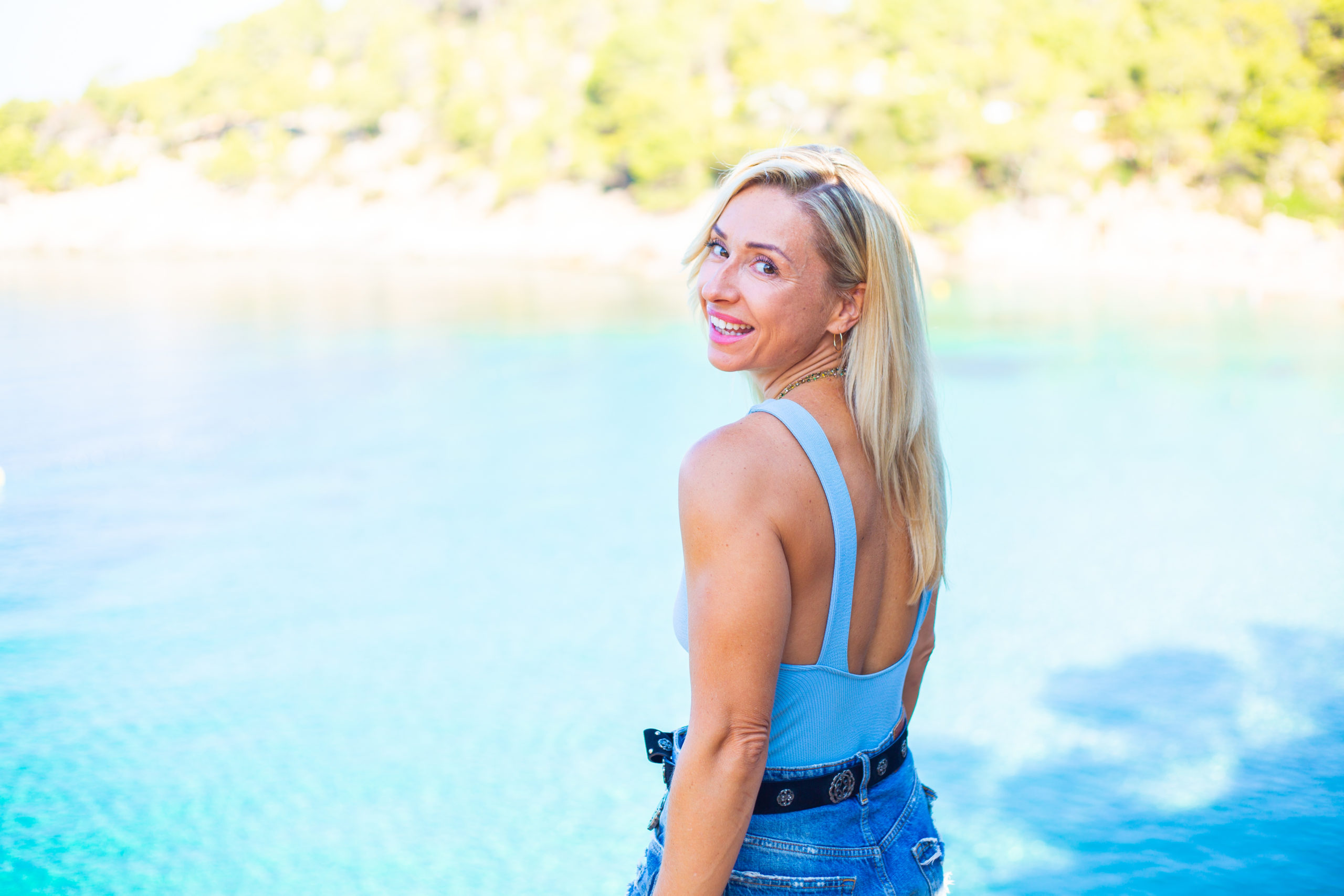 Lydia standing by the sea in Ibiza