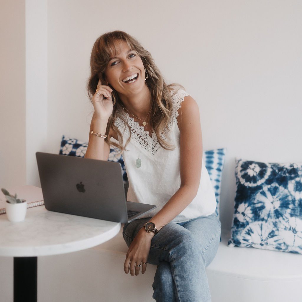 lady with laptop smiling